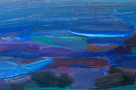 Blue background with oil paint. Beautiful brush strokes close-up. Textured abstract sea background. Oil painting on cardboard and canvas. Conceptual abstract mixed art. Mixed summer paint textureの写真素材