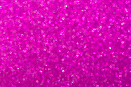 Abstract pink magenta background with unfocused bokeh. Fashionable bright shiny color of femininity, beauty. Festive pure pink layout of a postcard, a New Year banner. Valentine's Day backgroundの写真素材