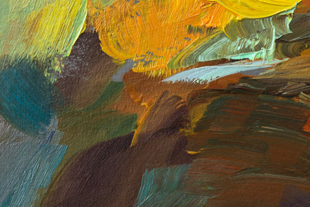 Abstract background autumn painting. Orange brown yellow beige mixed colors of oil paint. A fragment of an artwork in different shades of autumn shades. Modern handmade design with a brush on canvasの写真素材