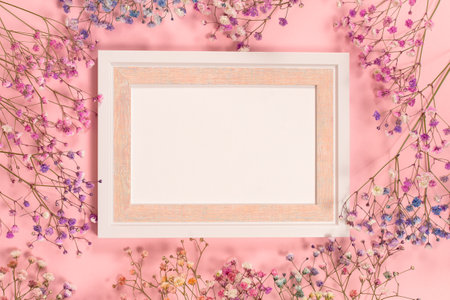 Flower composition pink flowers. A delicate bouquet of pink flowers on a pink pastel background. The concept of congratulations, romance. A postcard for Valentine's Day, Mother's Day. Flat lay, mockupの写真素材
