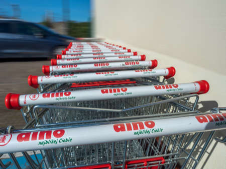 NIECHORZE, REWAL, BALTIC SEA, POLAND - 07/04/2020: DINO supermarket, trolleys standing in front of the main door, shopping, chain shopのeditorial素材