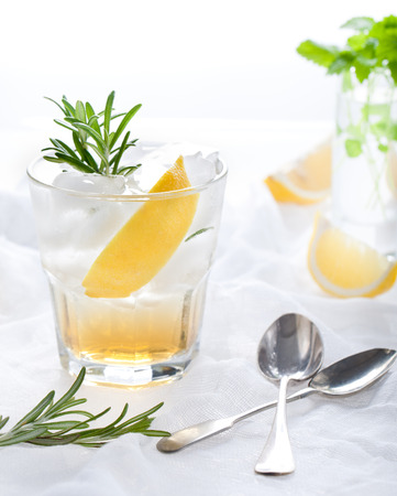 Gin,lemon, rosemary fizz, cocktail with honey and fresh herbsの写真素材