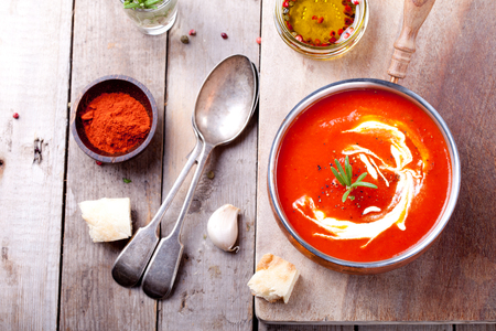 Tomato, red pepper soup, sauce with olive oil, rosemary and smoked paprikaの写真素材