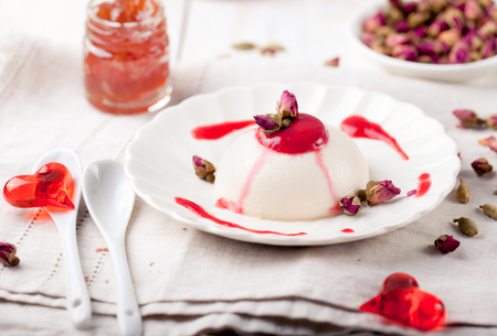 Rose flavor panna cotta, with berry sauce. Traditional Italian dessert.の写真素材