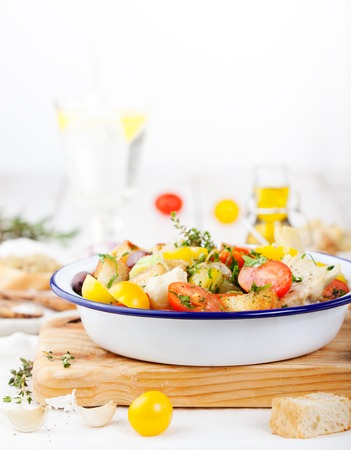 Traditional healthy Panzanella salad with fresh tomatoes and crispy bread Top viewの写真素材