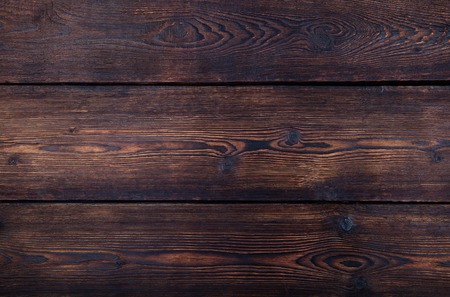 Dark brown wooden background with high resolution. Top view Copy spaceの写真素材