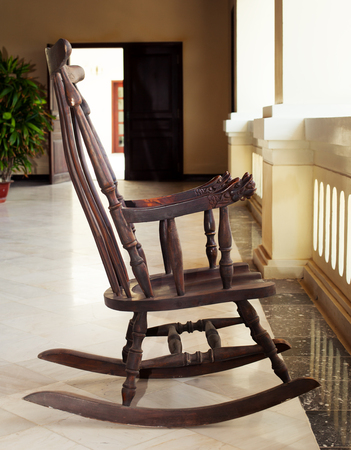 Vintage rocking chair, asian, wooden art at the hotel lobby.の写真素材