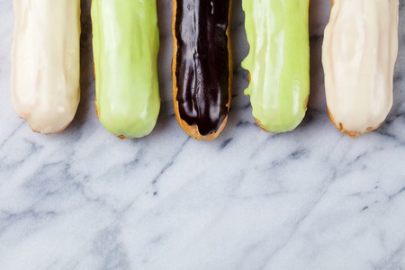 Eclairs traditional dessert Marble background. Copy space. Top view.の写真素材