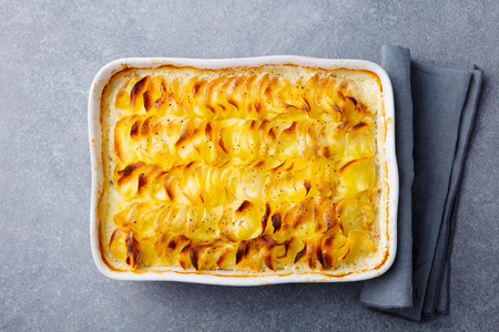 Potato gratin, backed potato slices with sauce.の写真素材