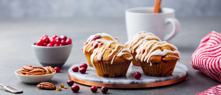 Muffins, cakes with cranberry and pecan nuts. Christmas decoration.
