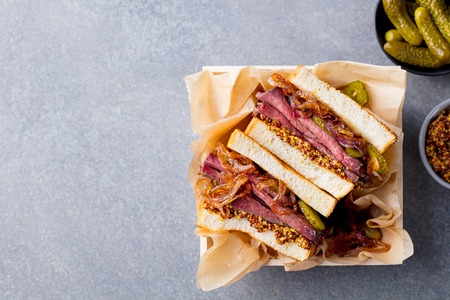Sandwich with roast beef in wooden box. Top view. Copy space.の写真素材