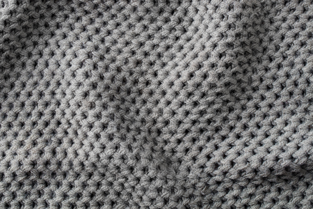 Grey knitted wool texture background pattern with high resolution. Top view. Copy space