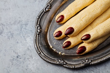 Cookies Witchs fingers for Halloween party celebration. Grey stone background. Copy space. Top viewの写真素材