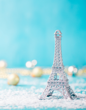 Christmas, New Year blue background with snow and Eiffel tower ornament. Copy space.の写真素材