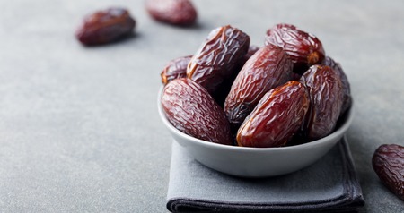 Fresh medjool dates in bowl.の写真素材