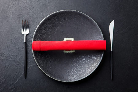 Halloween holiday table setting decoration with vampire teeth and red napkin.の写真素材