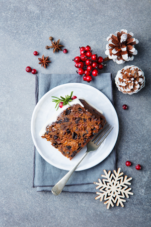 Christmas fruit cake, pudding on white plate. Top view.の写真素材
