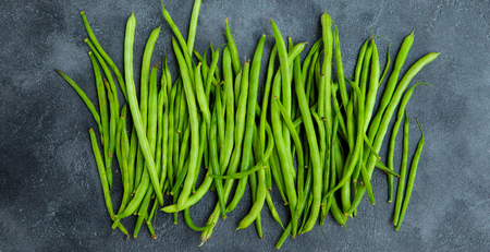 Green beans on grey stone