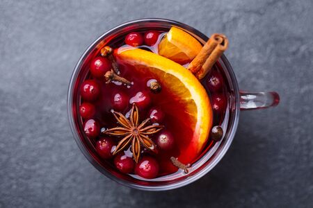 Mulled red wine with spices. Christmas decoration. Grey background. Top view. Close upの写真素材