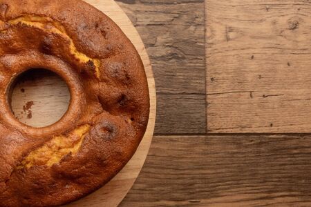 Brazilian carrot cake without chocolate seen from above on wooden rustic table.の写真素材