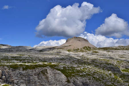 Beautiful view of Dolomites near Sass da Ciampac Sunny day, blue sky, white clouds. Italy.の写真素材