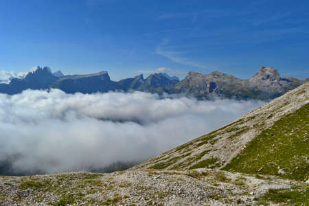 Sunny day in Dolomites. Fog in the valley, Cinque Torri Mountain.の写真素材