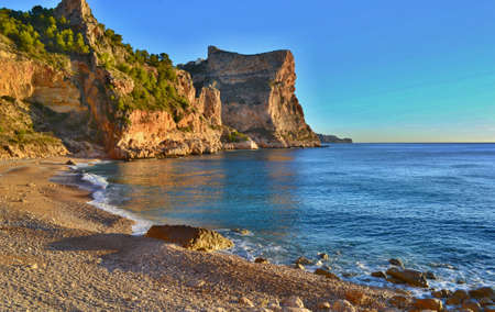 Beautiful beach in Spain with steep cliffs.の写真素材