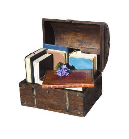 wooden chest with books isolated on whiteの写真素材