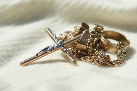 golden chain with a crossの写真素材