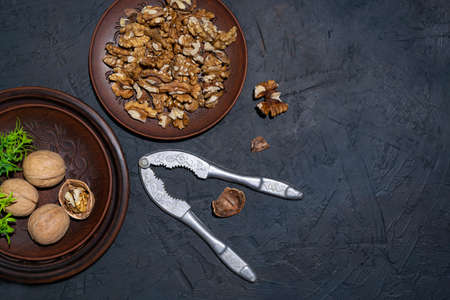 Peeled walnuts on a clay saucerの写真素材