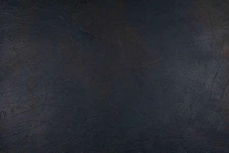 Dark textured concrete background with blue and brown streaks. Rough, rough texture. Top viewの写真素材