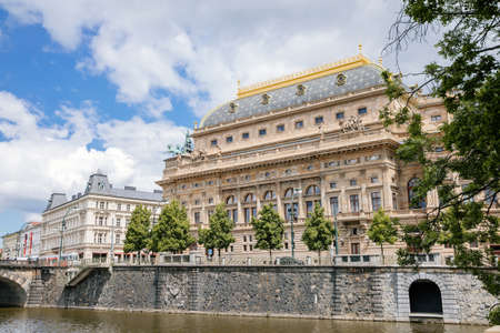 National Theater on the banks of the River Vltava on summer day, Prague, Czech Republic - May 26,...