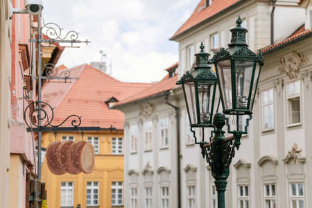 Street light and trdelnik shaped sign at the historic Nerudova street. Prague, Czech Republic. May 26, 2020のeditorial素材