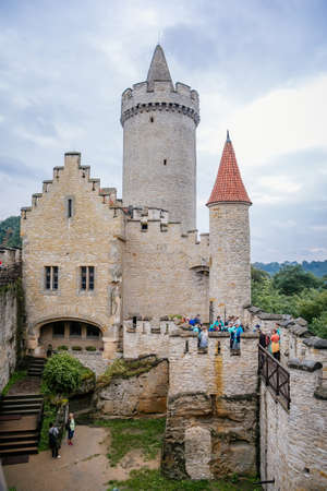 The medieval castle Kokorin with stone tower on a high hill in the green forest, Kokorin, Czech Republic. June 20, 2020のeditorial素材