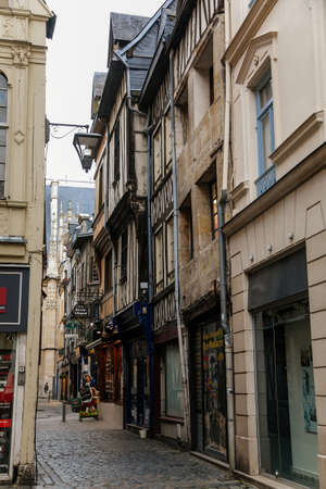 On the streets of the old town of Rouen with traditional half-timbered heritage houses. Rouen,...