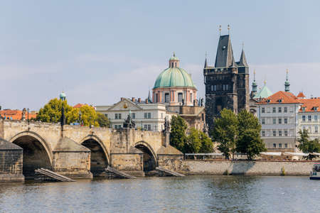 Charles Bridge over the Vltava river with old town tower, Prague, Czech Republic, August 09, 2020