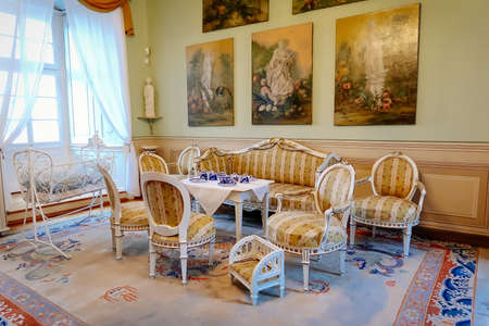 Castle interior. Tea room, wood carved chairs and table. Renaissance castle Horsovsky Tyn, Czech Republic, December 31, 2018のeditorial素材