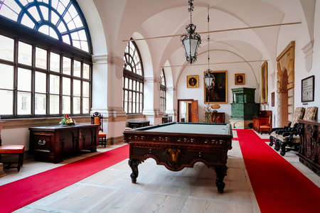 Castle interior decorated for Christmas and New Year. Hall with billiard. Renaissance castle Horsovsky Tyn, Czech Republic, December 31, 2018のeditorial素材