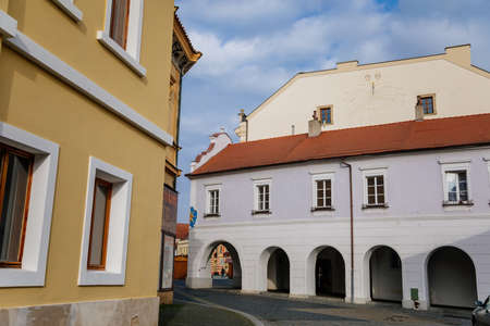 Medieval narrow old street with numerous cafes, colorful renaissance and baroque houses in Melnik, sunny autumn day, first floor arcade, Central Bohemia, Czech republic, November 14, 2020のeditorial素材
