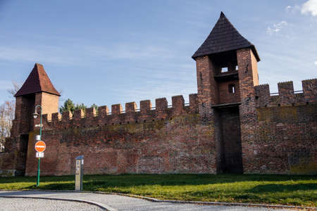 Silhuette of town fortification with battlement and watch tower in sunny autumn day, medieval gothic wall and rampart, Nymburk, Central Bohemia, Czech Republic, November 17, 2020のeditorial素材