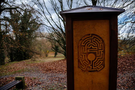 Wooden stands with the image of labyrinths in green garden in autumn day, Loucen romantic baroque...