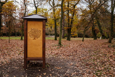 Wooden stands with the image of labyrinths in green garden in autumn day, Loucen romantic baroque castle, Czech republic, November 17, 2020のeditorial素材