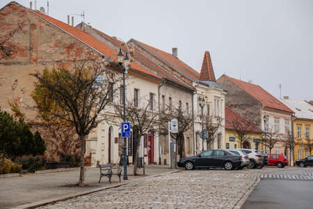 Main town Husovo Square at cloudy autumn day, picturesque street with colorful historical buildings...