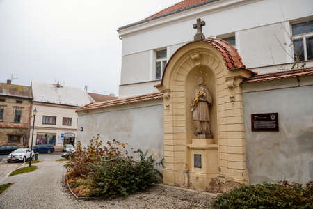 Baroque statue of Jan Nepomuk near Municipal Library in old historic center of Cesky Brod, Central Bohemia, Czech Republic, November 28, 2020のeditorial素材