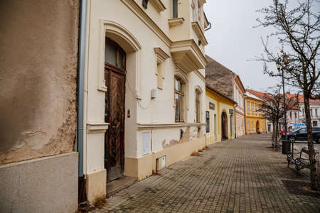 Main town Husovo Square at cloudy autumn day, picturesque street with colorful historical buildings in old historic center of Cesky Brod, Central Bohemia, Czech Republic, November 28, 2020のeditorial素材