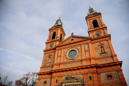 Facade of the Church of Saint Wenceslas (Saint Vaclav) in Smichov district, three-aisled nave red basilica with two towers in neo-renaissance or pure style, Prague, Czech Republic, November 15, 2020のeditorial素材