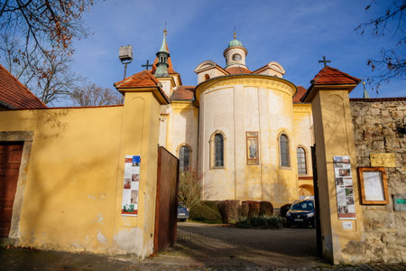 Yellow baroque church of the Holy Trinity near Discalced Carmelite Monastery in old historic center...