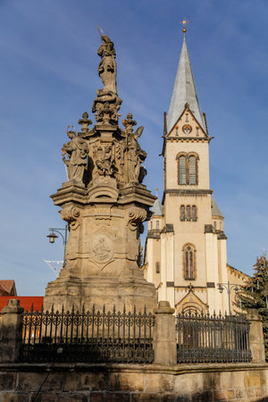 Church of the Assumption of the Virgin Mary and Marian column, Christmas market at Square Namesti starosty Pavla in Kladno in sunny day, Central Bohemia, Czech Republic, December 27, 2020のeditorial素材