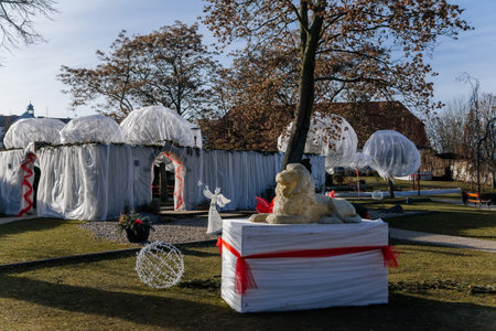 Christmas decorations, garlands and ribbons at baroque castle park in winter sunny day, historical town center of town Kladno, Central Bohemia, Czech Republic, December 27, 2020のeditorial素材