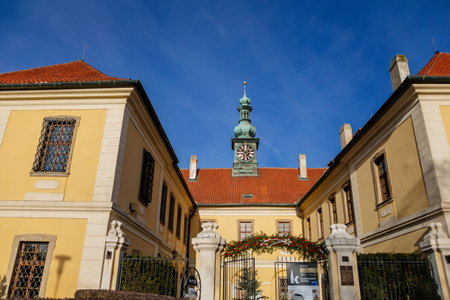 Baroque chateau with clock tower, Castle and town gallery with Christmas decorations in winter sunny day, medieval city Kladno, Central Bohemia, Czech Republic, December 27, 2020のeditorial素材